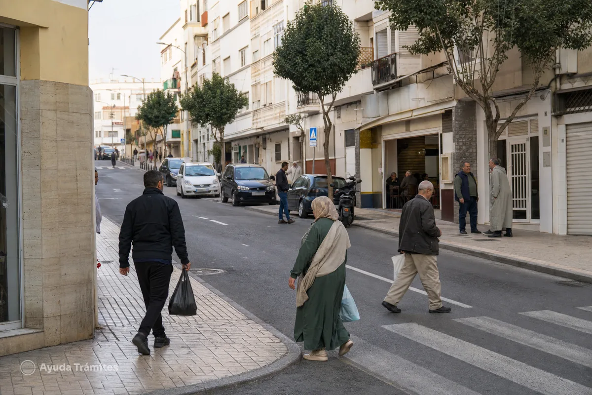 People going about their daily lives on a street in Ceuta.